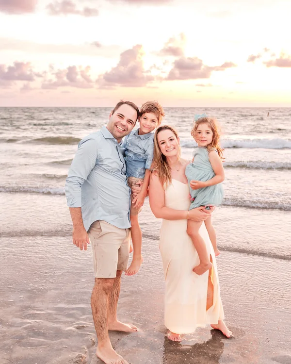Family photographed at sunset during an Indian Rocks Beach session