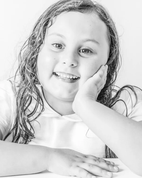 Child photographed during a natural-light studio portrait session in Deltona