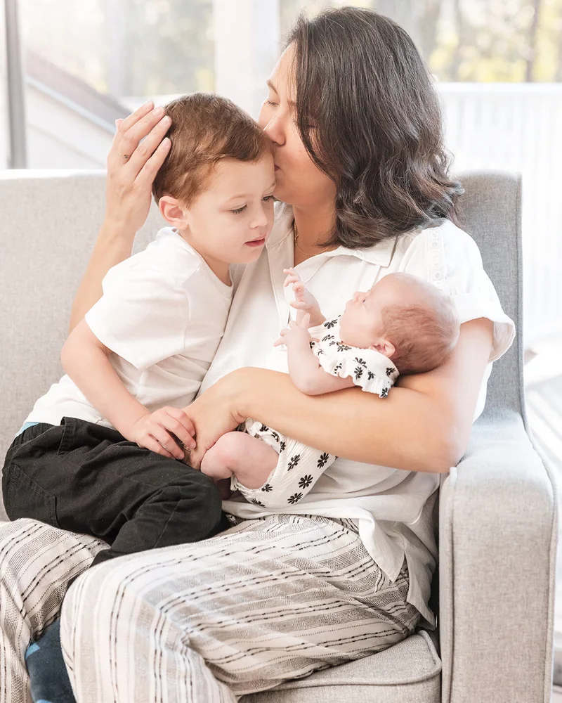 Parent holding newborn baby during a Central Florida newborn session