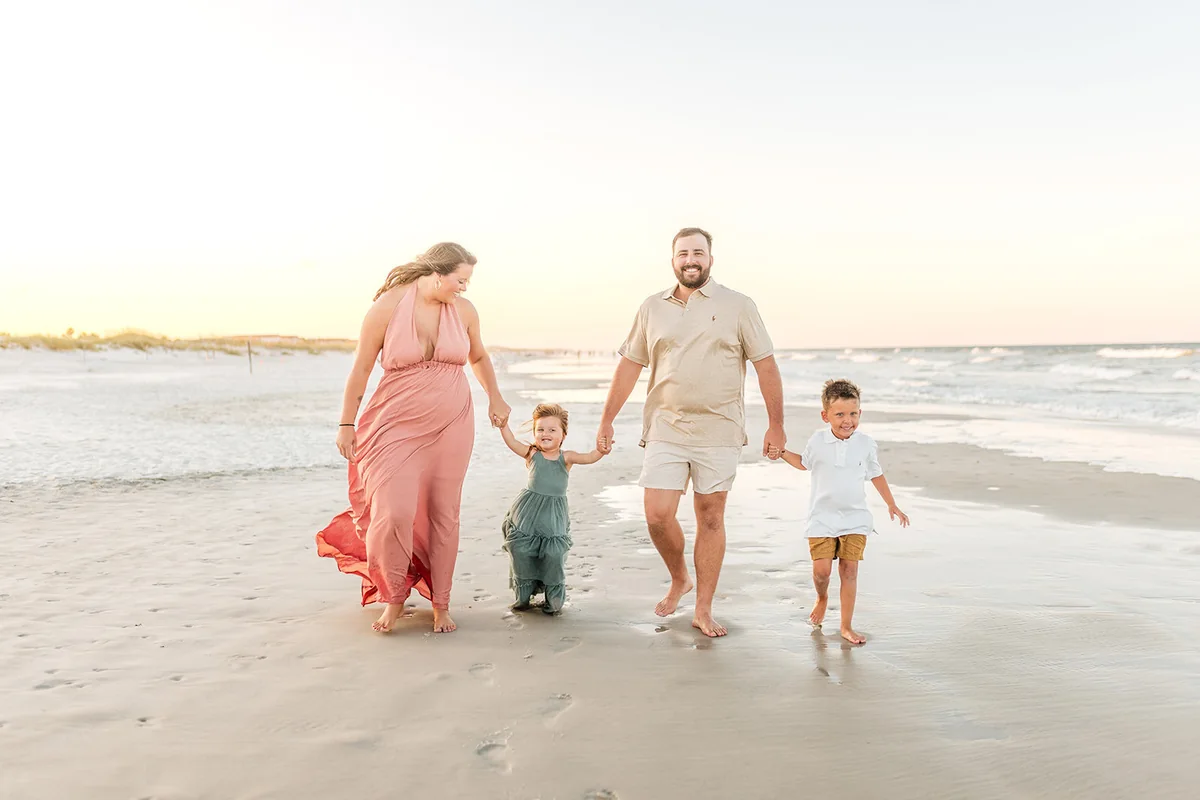Family walking along St. Augustine Beach shoreline