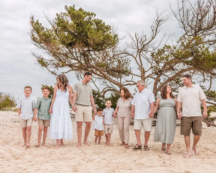 Family photographed on St. Augustine Beach during a beach session
